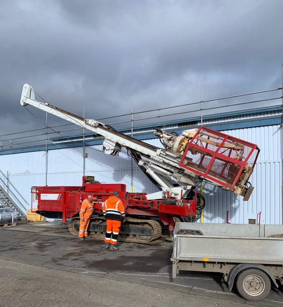 Drilling machinery being set up by to engineers at a bottling plant in Sunderland.