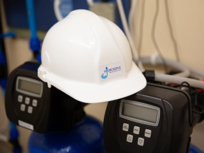 A Hydroserve hard hat placed on top of a Water Treatment System.